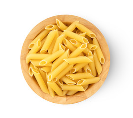 Pile of raw macaroni in wood bowl on white background