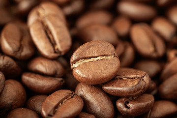 Coffee beans macro, natural brown background, selective focus