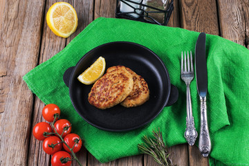 Fried cutlet with dill on a plate