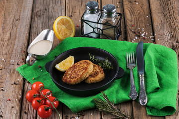Fried cutlet with dill on a plate