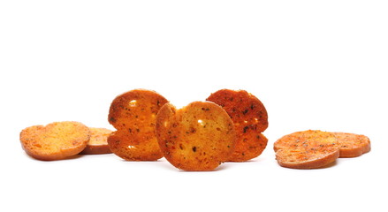 Bruschette chips, grilled bread crisps with tomatoes, olives and oregano, savory snacks isolated on...