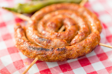Grilled homemade sausages and green peppers. Barbecue
