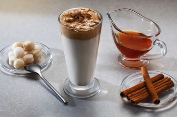 Dalgona coffee - the Korean coffee drink on wooden background. Instant coffee or espresso powder whipped with sugar and hot water. Iced whipped dalgona coffee concept.top view.