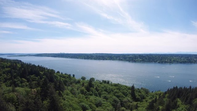 Drone Rising Over Trees to Reveal Lake Washington Weekend Boating