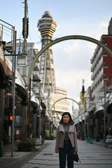 Fototapeta na wymiar Traveller female posting on city scape with Japan travel trip.