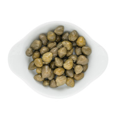 Small capers - appetizer of vegetables in olive oil. Homemade preserves as a side dish or aperitif