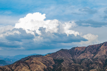 amazing photography of mountains and cloud covered sky in the background