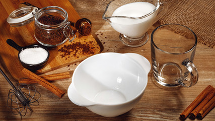 Cooking step-by-step Korean Dalgona coffee. Set of products: instant coffee, milk, water, sugar. Step 1