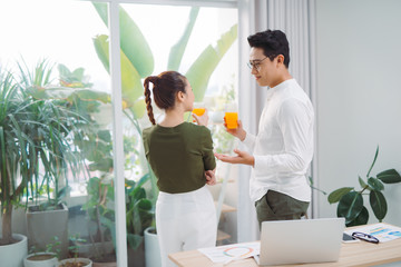 two young colleagues working in an office