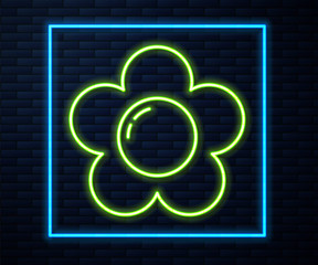 Fototapeta premium Glowing neon line Flower icon isolated on brick wall background. Vector