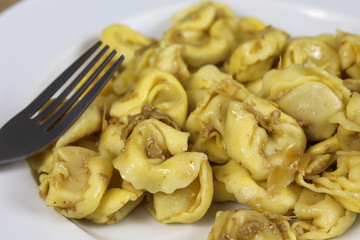 plate of tortellini on a table