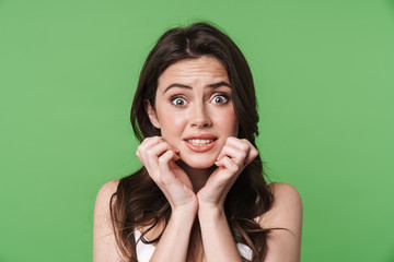 Image of scared caucasian woman posing and looking at camera