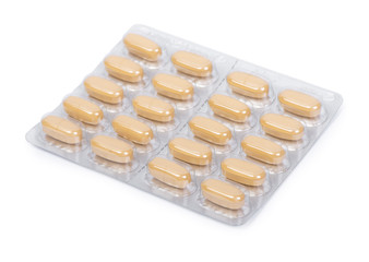 Yellow pills in a blister pack