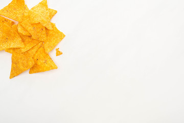 top view of corn nachos on white background