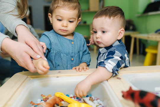 Kids in nursery blay with orbeez. Cute little children