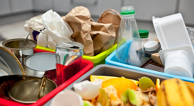 The four different container for sorting garbage. For plastic, paper, metal and organic waste
