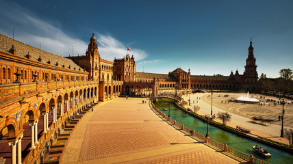 Fototapeta premium Seville, Spain - February 18th, 2020 - Plaza de Espana / Spain Square in Seville City Center with Architecture Details, Horse Carriages and centered Fountain.