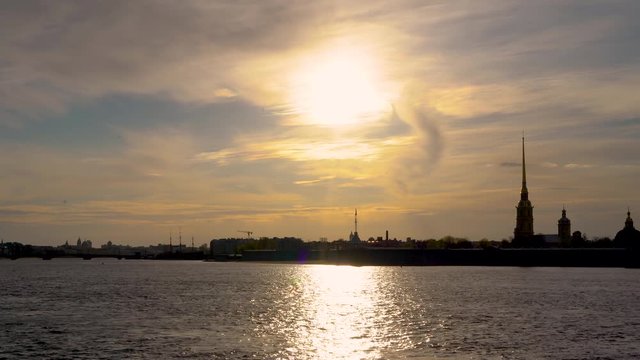 Russia, Saint Petersburg, Peter and Paul fortress, may-08, 2020: Peter and Paul fortress and the Neva river at sunset in Saint Petersburg. Urban landscape. Time Lapse.
