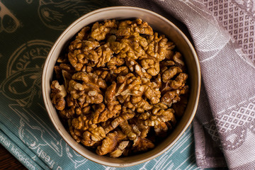 walnut in a bowl on a dark background
