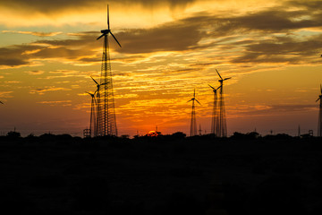 Windmills in Jaisalmer desert area, view from Bara bagh Jaisalmer, Rajasthan India
