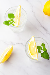 cocktail with lemon and mint on white