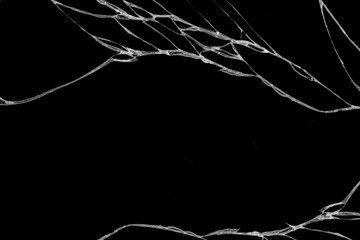 Art of wrinkles and cracks of glass caused by smashing and falling bumps. isolated on black...
