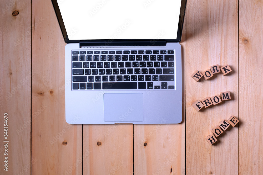 Aufkleber open computer laptop portable on white blank display and wood cube letter put on wooden table inform