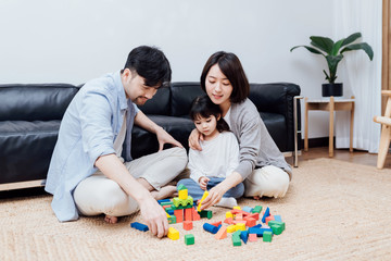 A family playing with building blocks