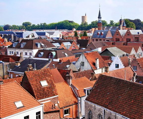 Bruges, Belgium. Bruges city panorama overlooking the powder tower, tiled roofs and bell towers  