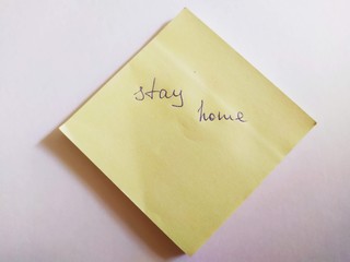 Written on yellow note paper- stay home