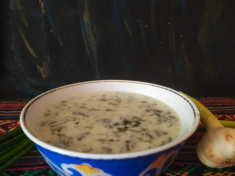Creamy soup dovga filled with herbs