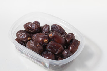 Dried dates fruits on white background, tasted sweet and chewy