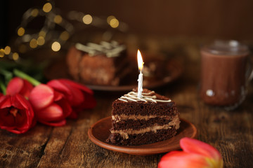 holiday table with cake with candles, cocoa and flowers tulips, quarantined birthday.