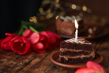 holiday table, quarantined birthday, cake with a candle, chocolate cake. View from above
