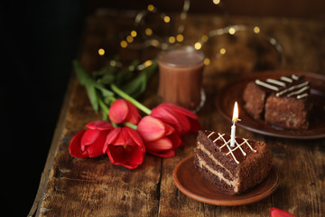 holiday table, quarantined birthday, cake with a candle, chocolate cake. View from above
