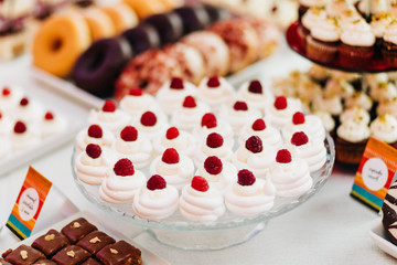 Wedding candy bar with Pavlova and donuts