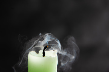 Smoke from a candle on a black isolated background. An interesting and weird smoke pattern