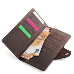 Brown leather wallet with euro banknotes isolated on white