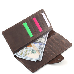 Brown leather wallet with dollars banknotes isolated on white