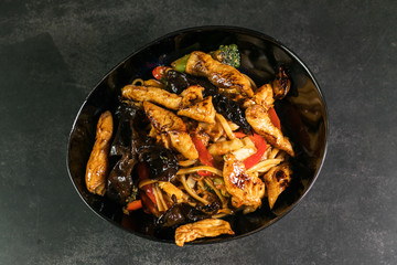Stir fry chicken, sweet peppers. wok
