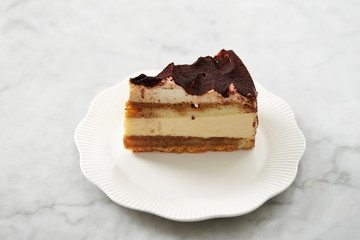 Piece of tiramisu cake on plate