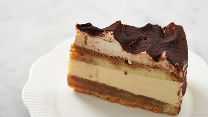 Piece of tiramisu cake on plate