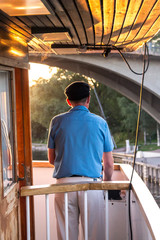 Boat captain in sunlight