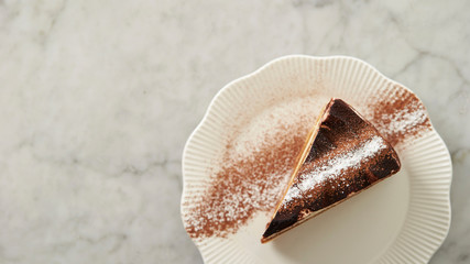 Piece of tiramisu cake on plate
