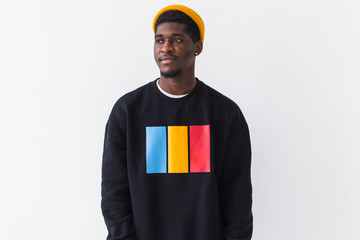 Youth street fashion concept - Portrait of confident sexy black man in stylish sweatshirt on white...