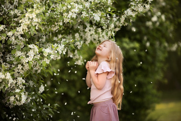 baby girl angel in the Apple trees happy