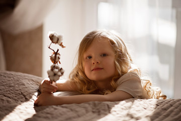 Fototapeta premium baby girl angel with light hair curly