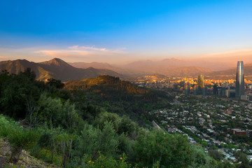 Panoramic view of Santiago with Parquemet Metropolitan park and Cerro Manquehue at sunset, Santiago de Chile, Chile