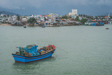 Fishing Boat At Anchor Off Poor Village In Nha Trang. Vietnam