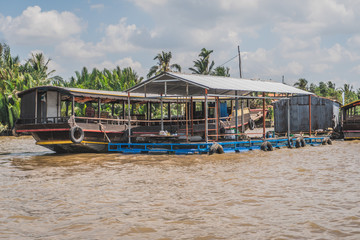 Traditional Vietnamese ferry boat taking people and their bicycles across the Mekong River in Vietnam, South East Asia. Vung Tau, Vietnam - FEBRUARY 28, 2020